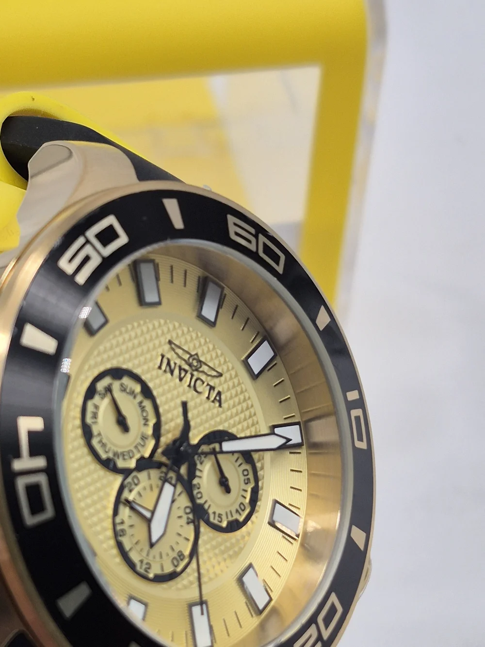 Invicta Gold and Black Chronograph Watch with Turquoise Case